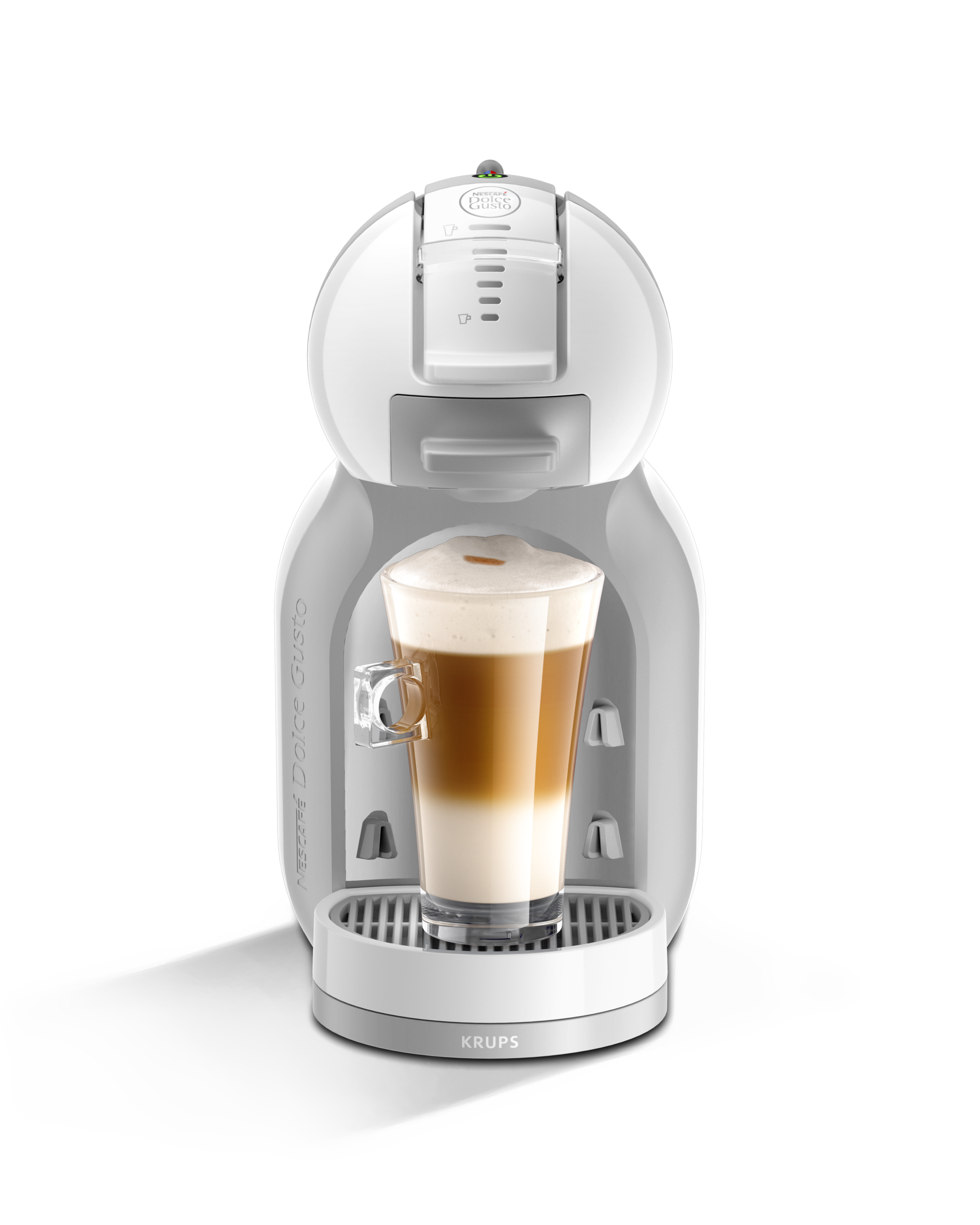 Máquina de café Krups Dolce Gusto blanca con un vaso de café en capas en su interior.