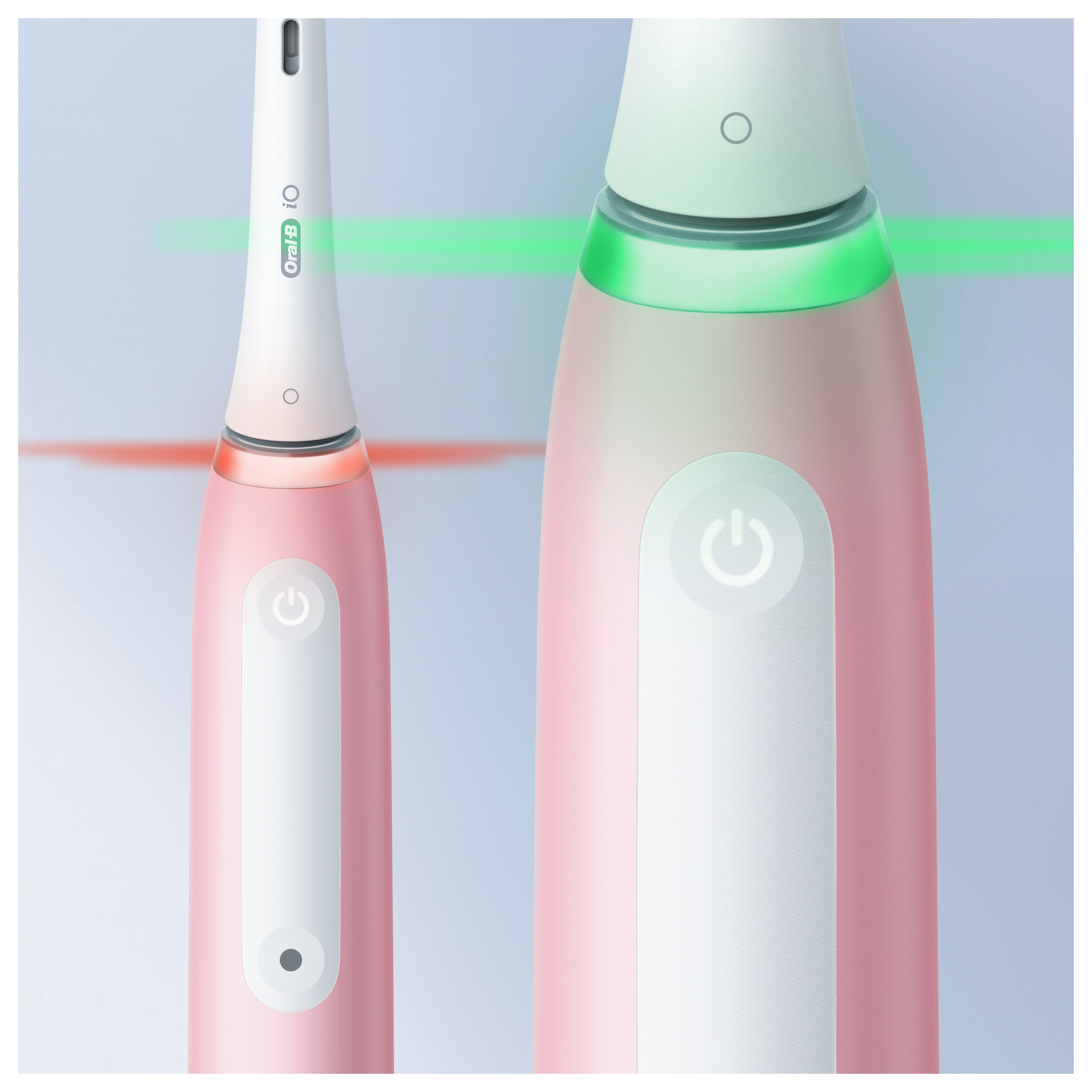 Rózsaszín-fehér elektromos fogkefe zöld és piros fényjelzőkkel.