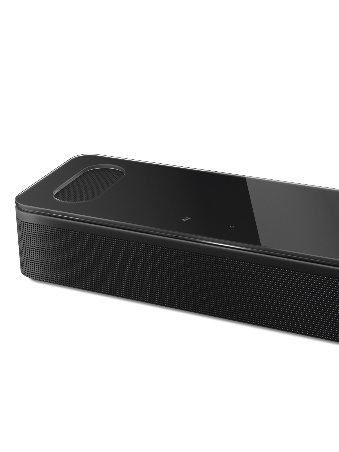 Schwarze Soundbar mit glänzender Oberseite und Lautsprechergitter, auf schwarzem Grund.