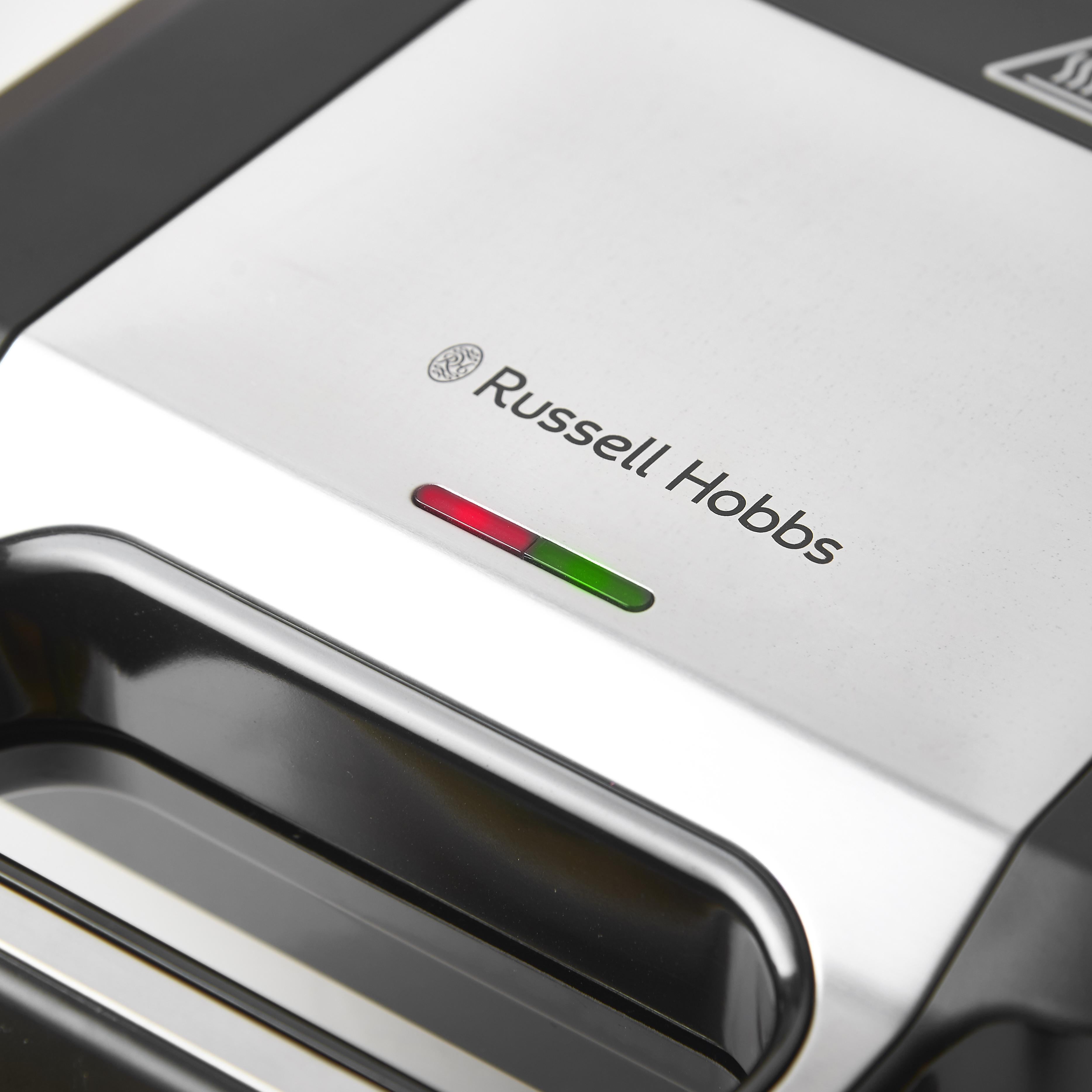 Russell Hobbs Sandwichmaker, Draufsicht, zeigt das Markenlogo und eine rot/grüne Kontrollleuchte.