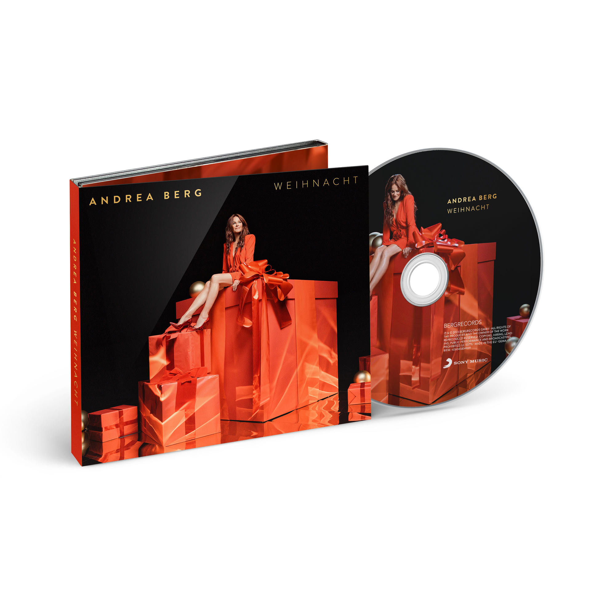 Andrea Bergs Weihnachtsalbum Cover und CD. Rotes Geschenkbox-Design mit dem Bild des Künstlers.