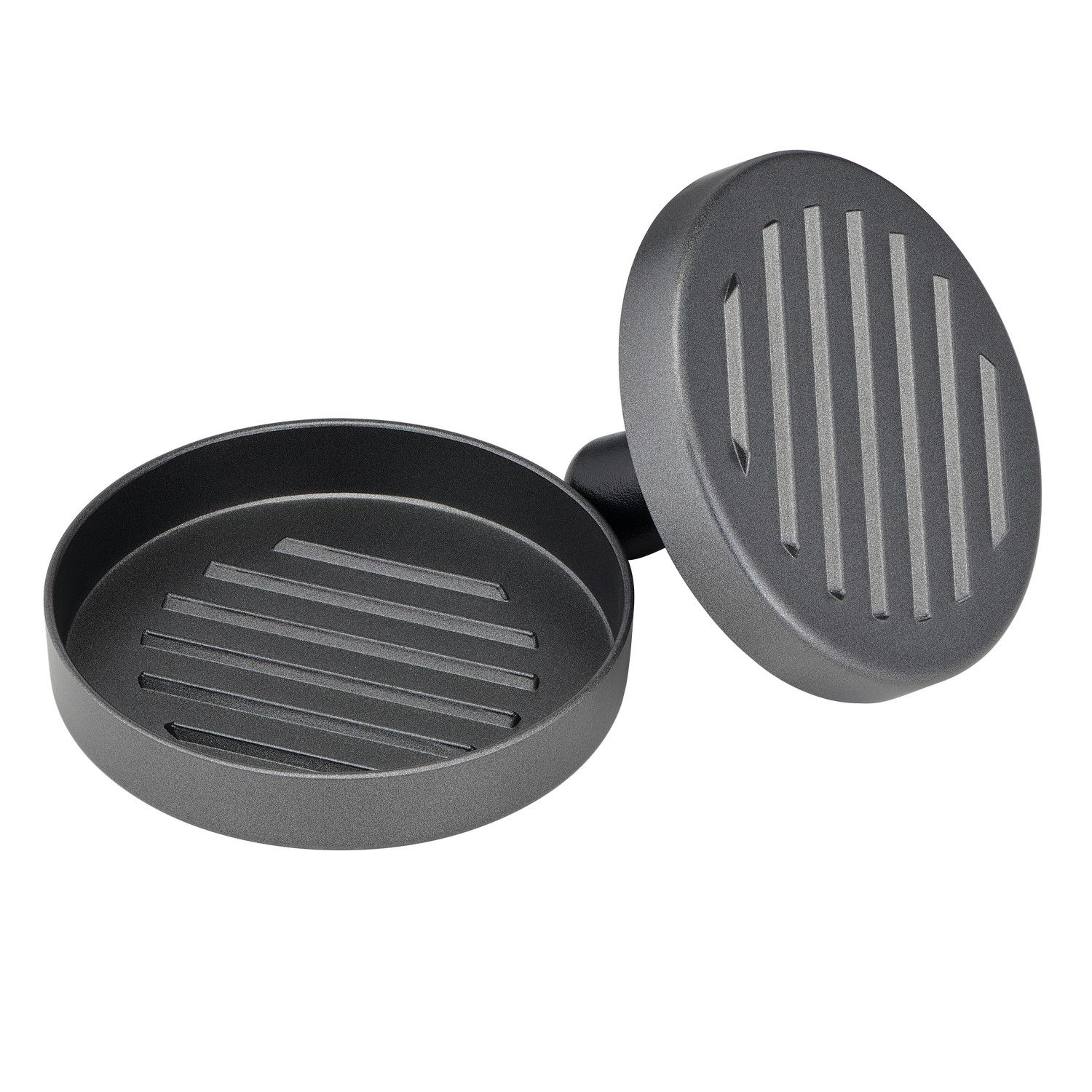 A round, dark grey burger press, with the top and bottom separated.