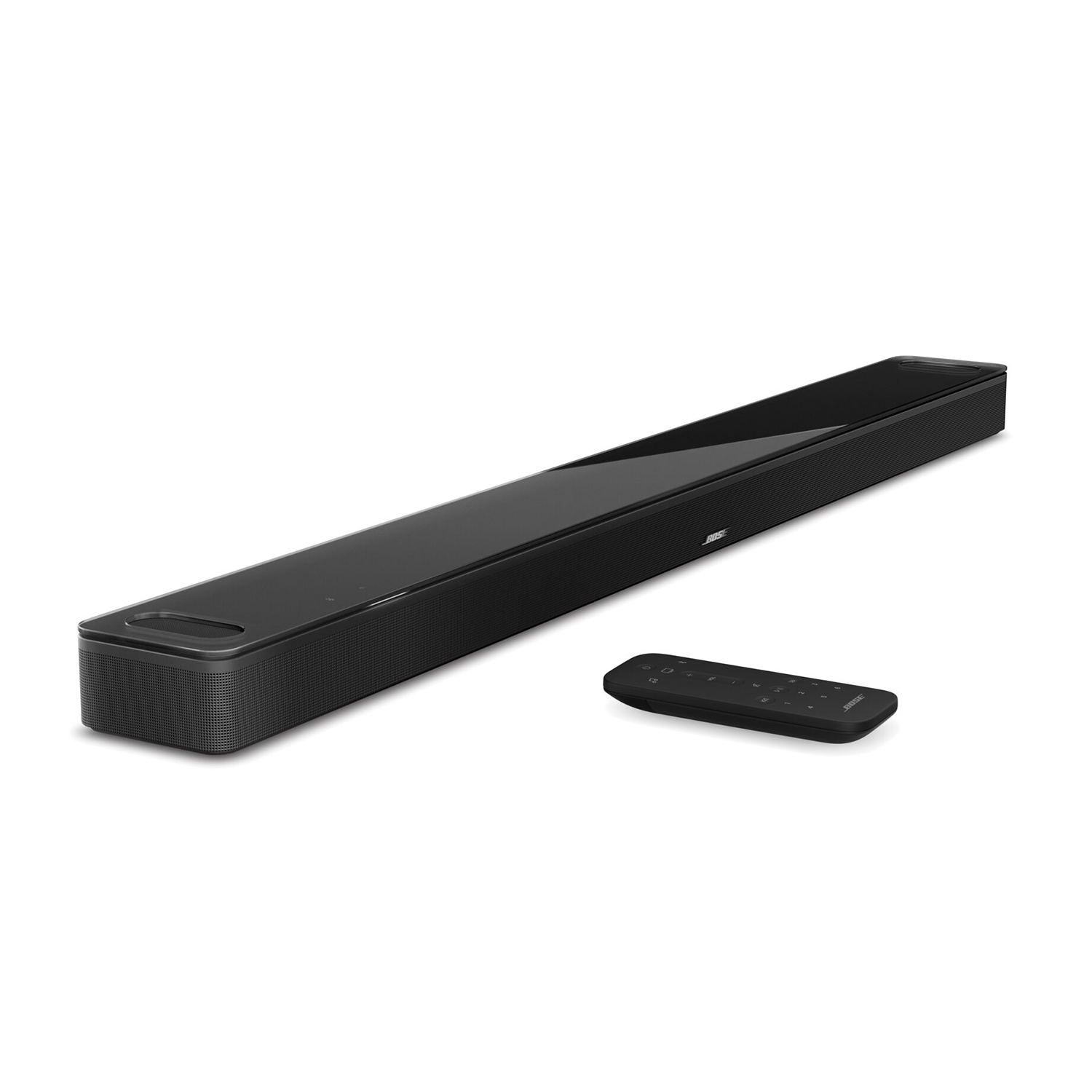 Soundbar nera con telecomando, posizionata su una superficie bianca.