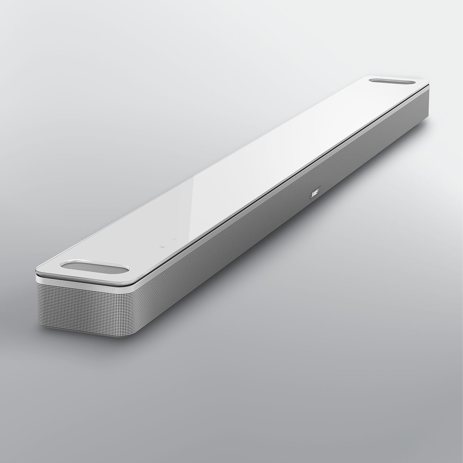 Altoparlante soundbar bianco su sfondo grigio chiaro.