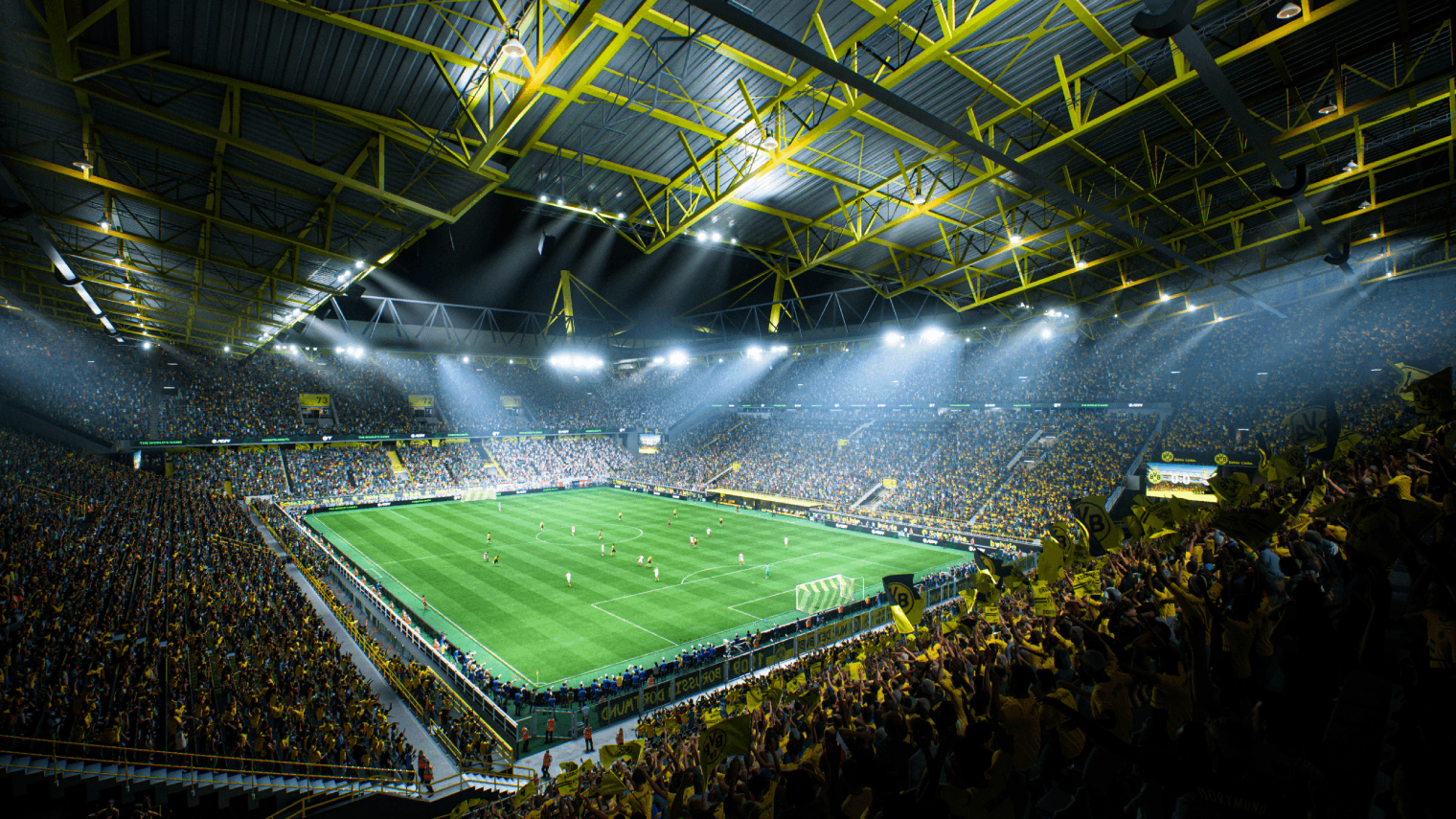 Estadio de fútbol iluminado con asientos amarillos, lleno de espectadores viendo un partido.