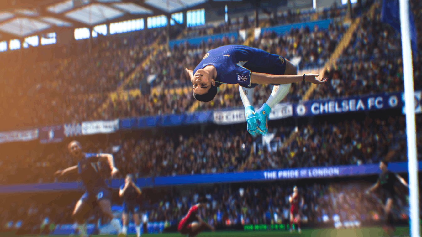 Un jugador de fútbol haciendo un flip en el aire durante un partido en un estadio.