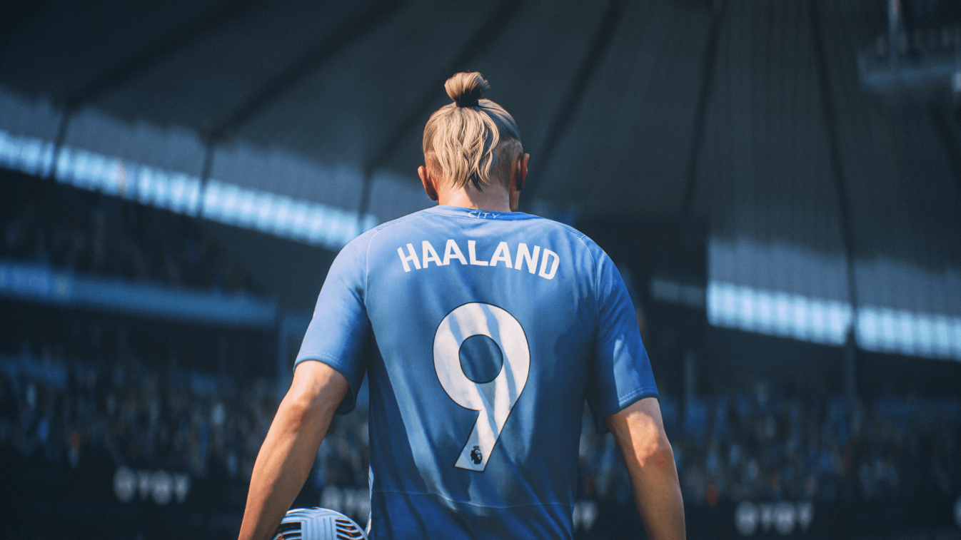 Jugador de fútbol con camiseta azul con nombre 'HAALAND' y número '9' en la espalda.