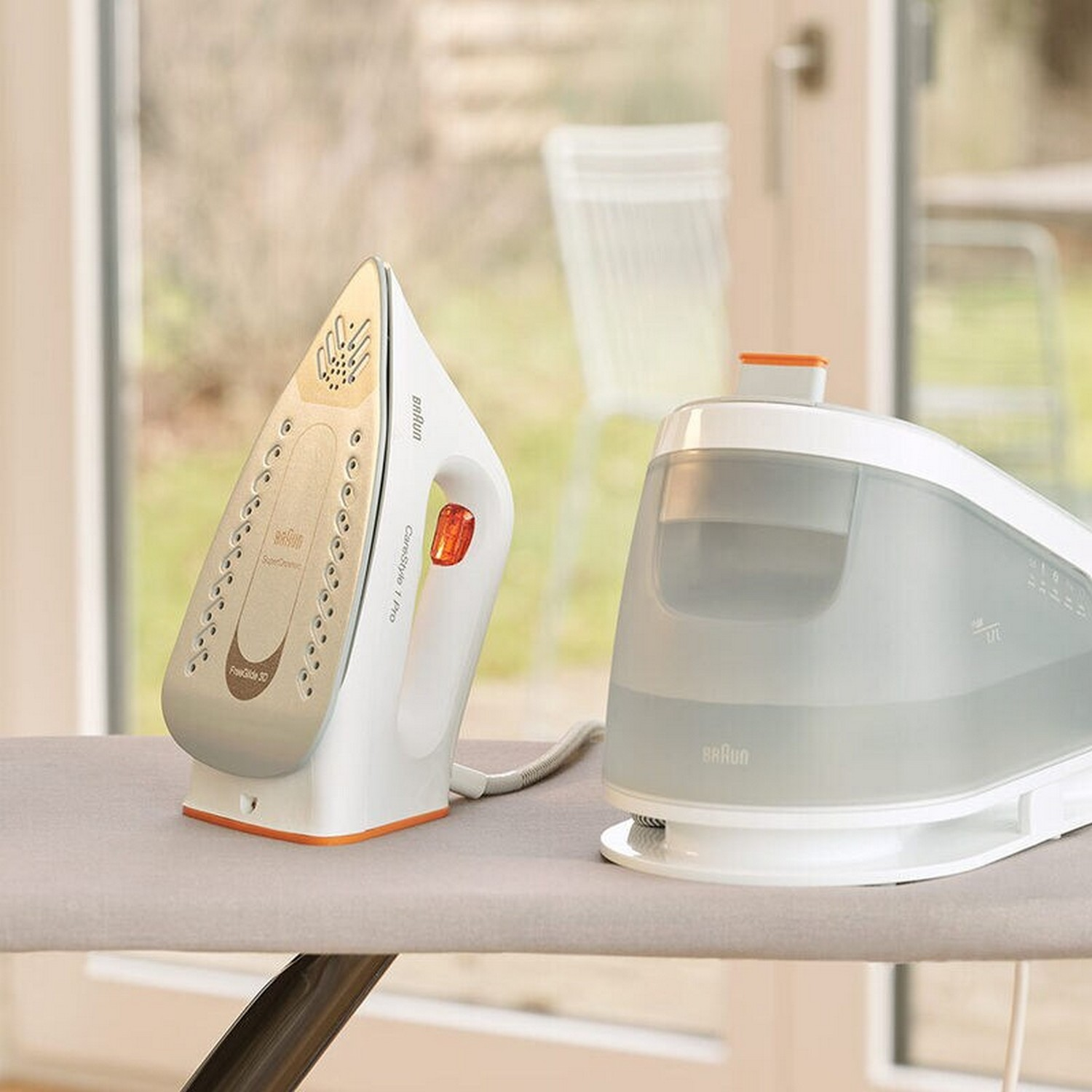 White and gold iron with a steam generator on an ironing board.