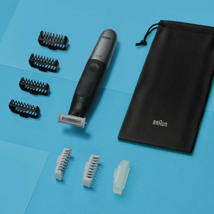 Braun X75 szakállvágó tartozékokkal kék felületen.