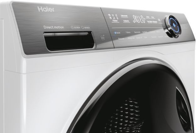 Close-up van het bedieningspaneel van een witte Haier wasmachine met knoppen en display.