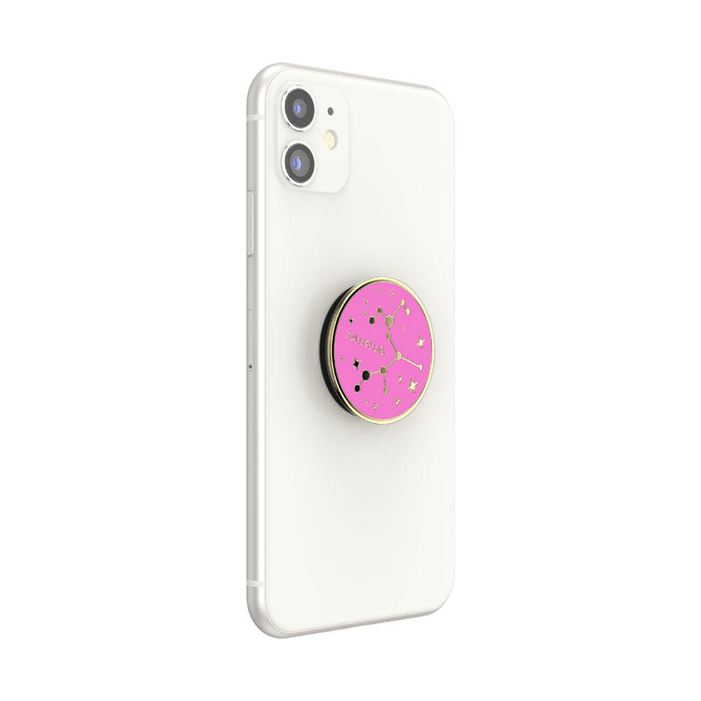 Weißes iPhone mit pinkem und goldenem Widder PopSocket, weißer Hintergrund.
