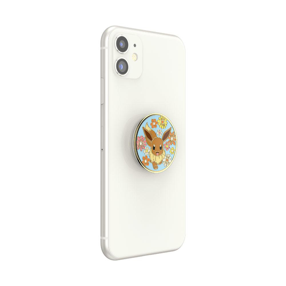 Weißes Telefon mit einem Evoli PopSocket. Der PopSocket hat einen floralen Hintergrund und Evoli.