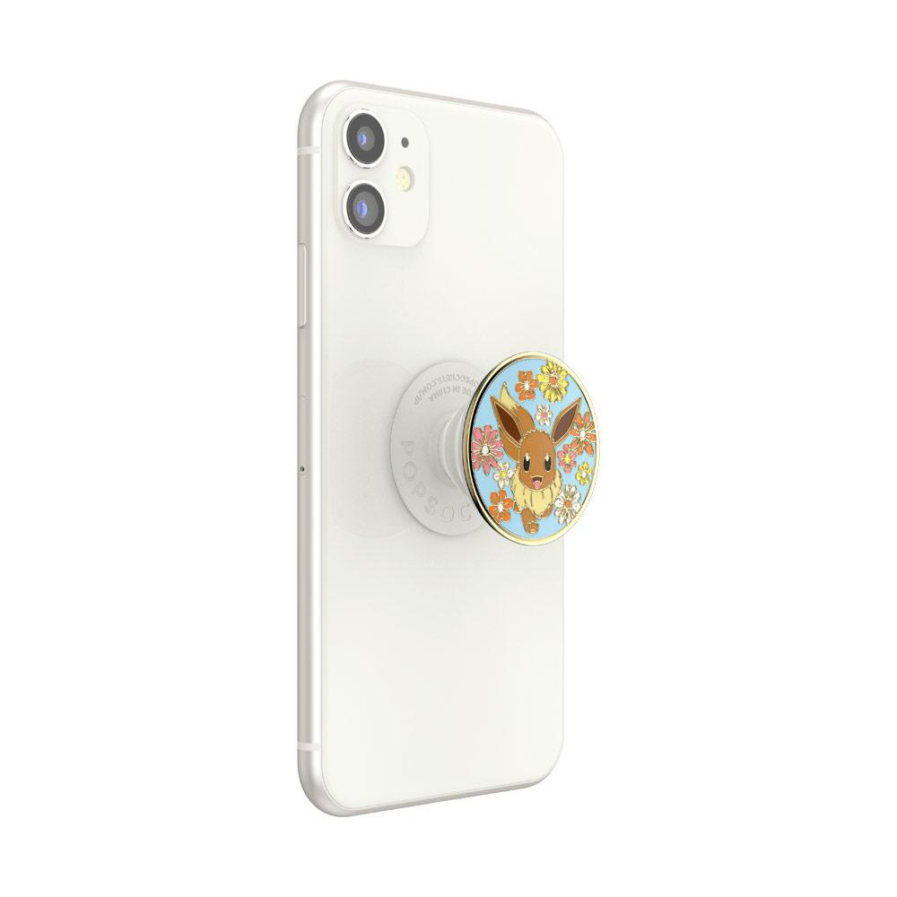Ein weißes iPhone mit einem PopSocket, das einen Evoli-Charakter zeigt.