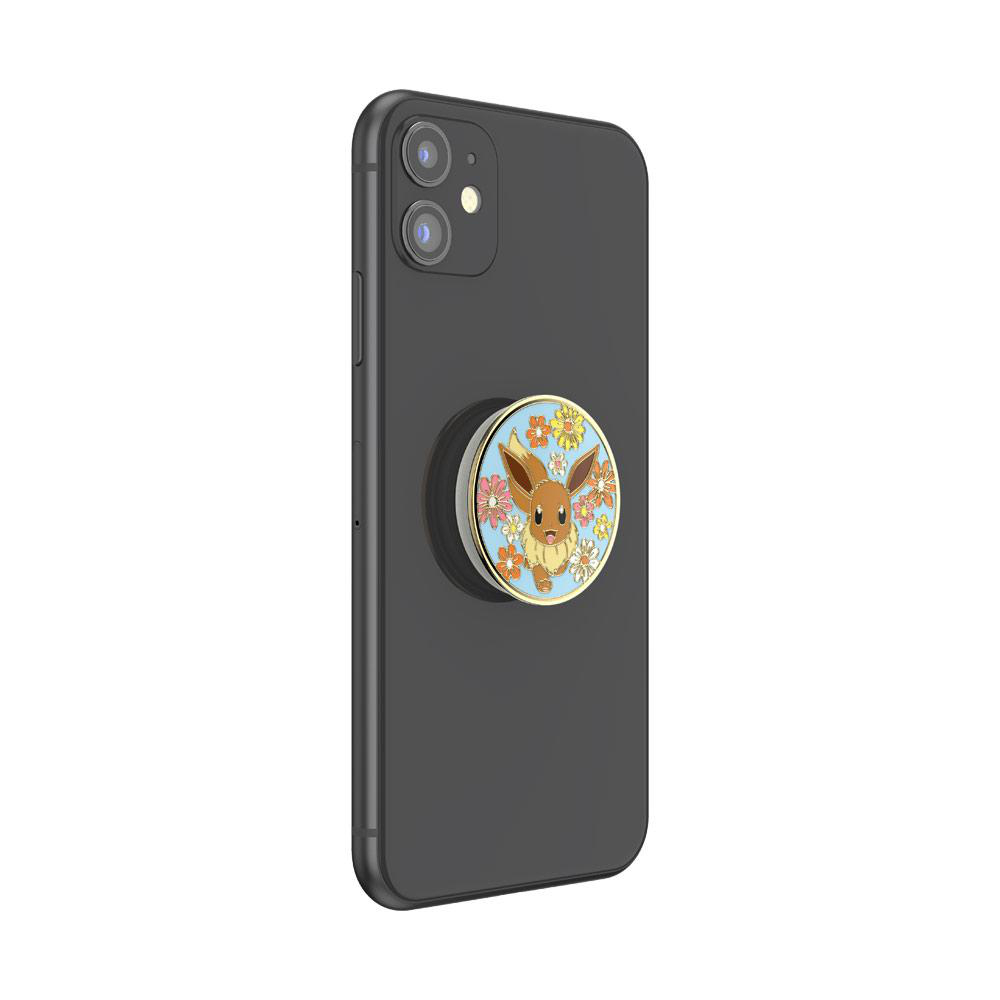 Ein schwarzes Smartphone mit einem Eevee PopSocket, mit einem Cartoon-Eevee mit Blumen.