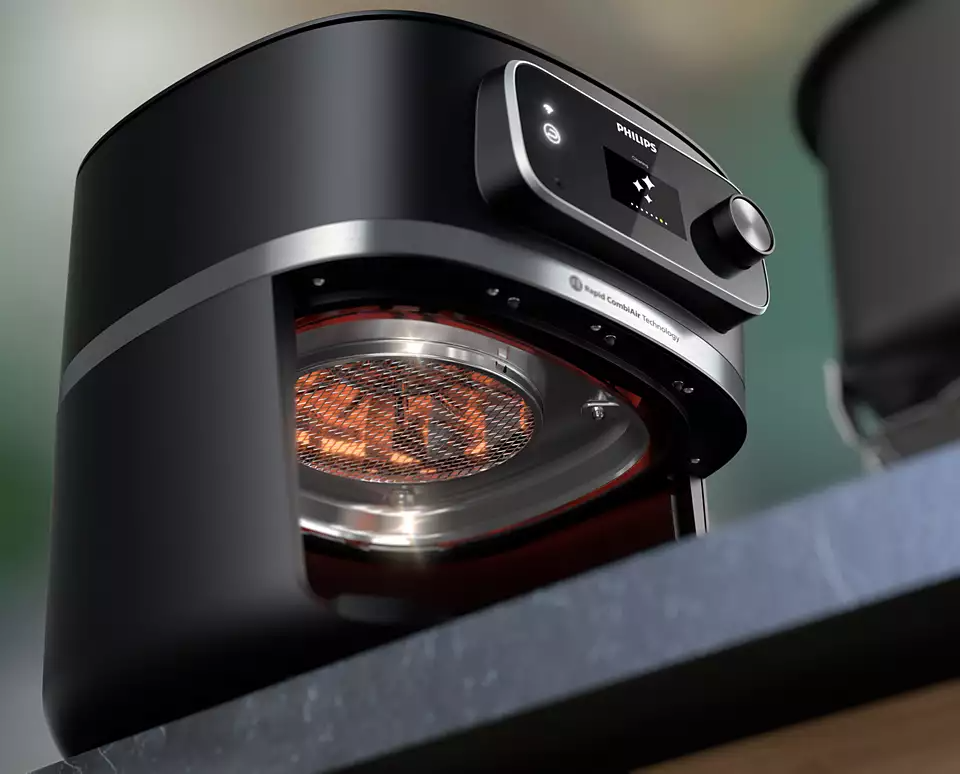 Fekete Philips air fryer a polcon, elölnézet, látható részletek.