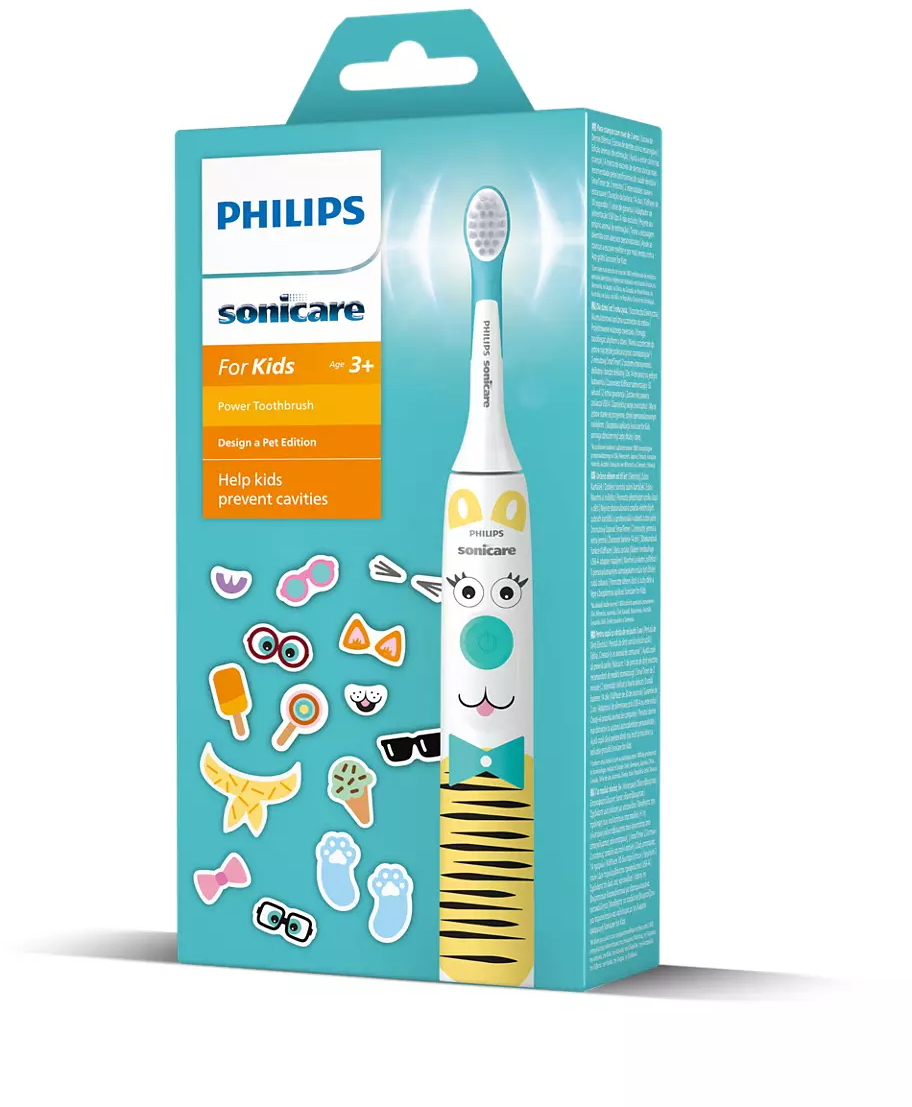 Fogkefe doboz fogkefével gyerekeknek, matricákkal, kék háttérrel.
