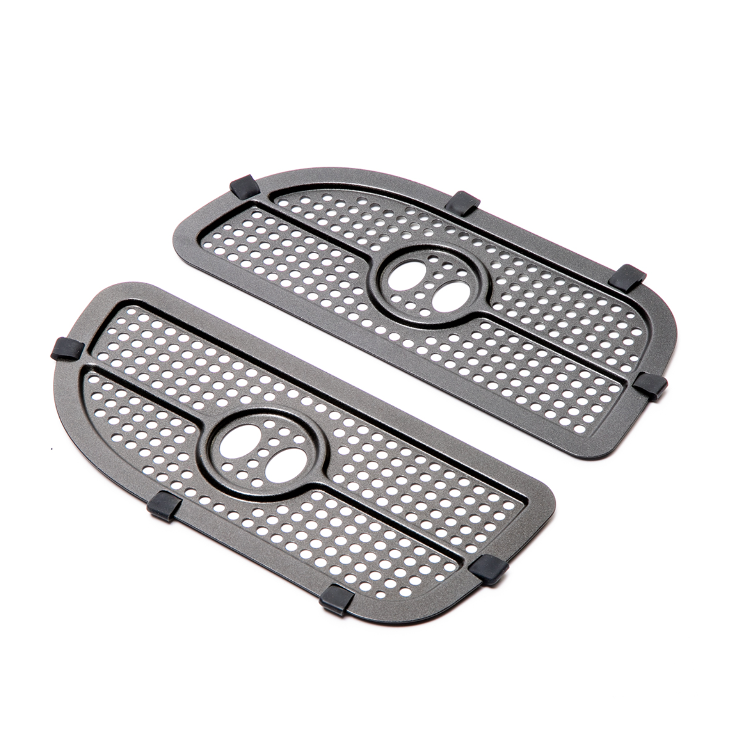 Two gray metal grilles with holes, oval openings, and black rubber feet, isolated on white. Perforated design.