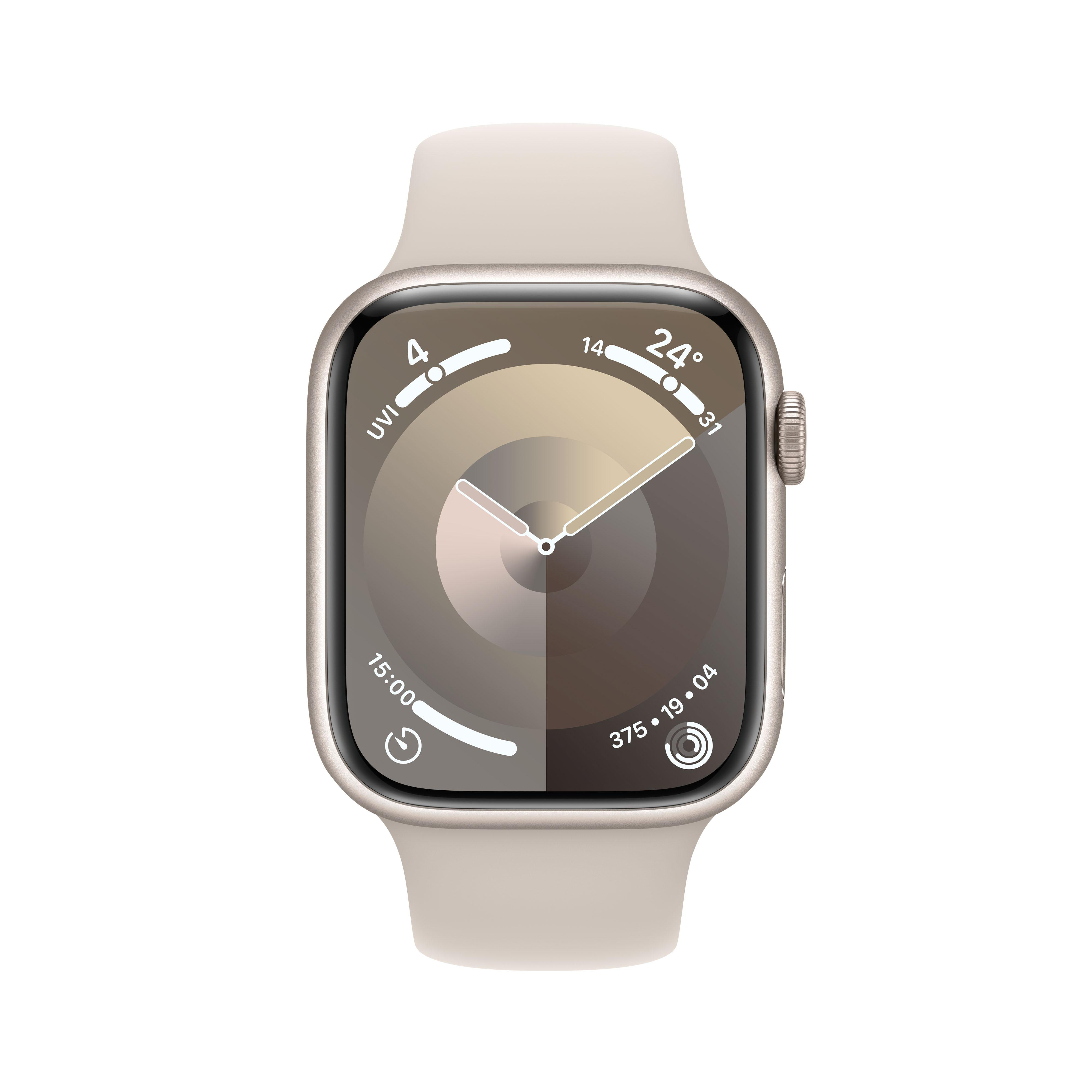 Apple Watch mit hellbeigem Armband. Das Zifferblatt zeigt die Uhrzeit und andere Metriken an.