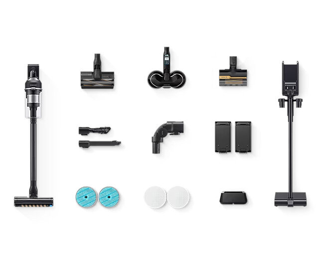 Części odkurzacza, w tym jednostka główna, kilka głowic szczotkowych i baterie, są ułożone.