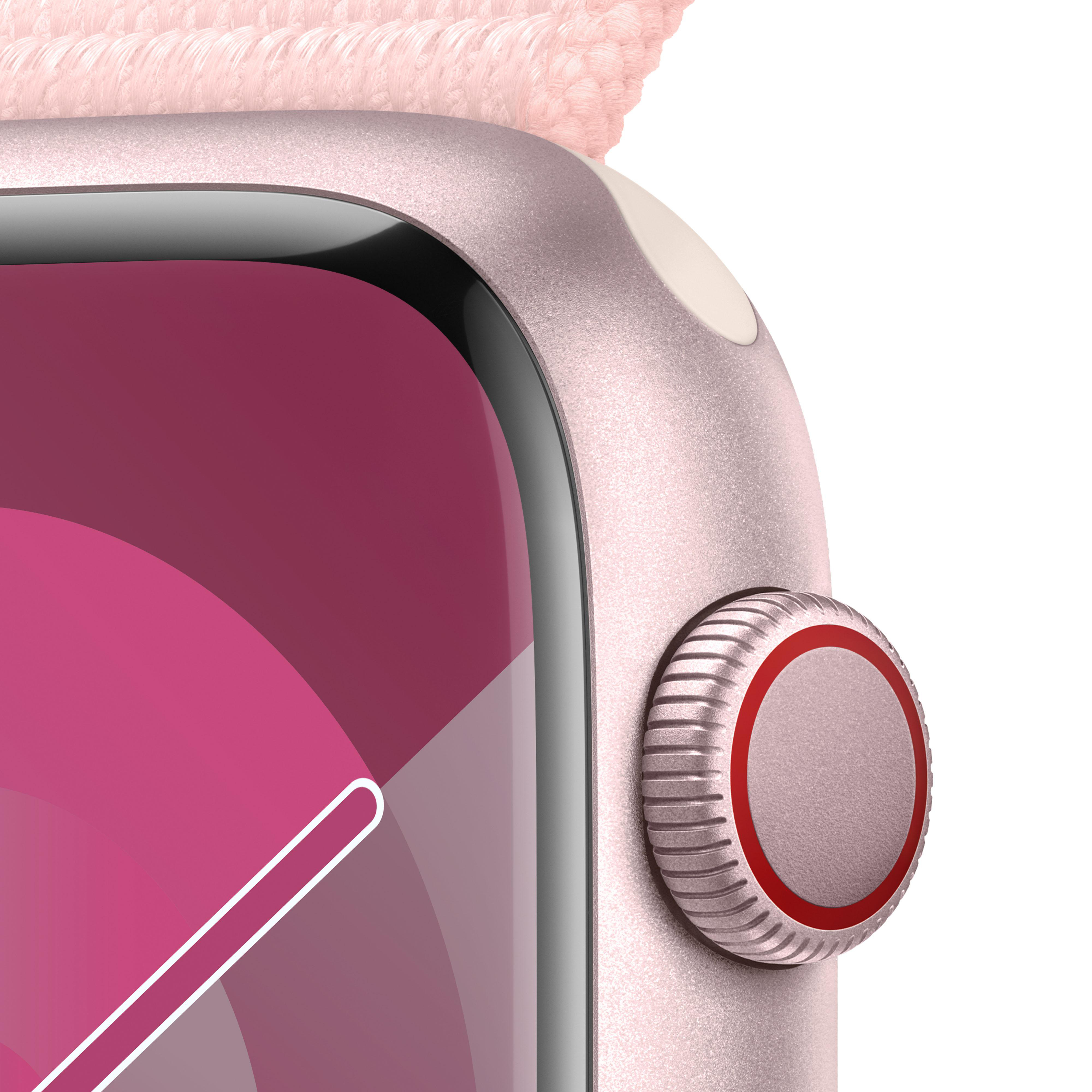 Nahaufnahme einer pinken Apple Watch mit cremefarbenem Armband, zeigt die digitale Krone.