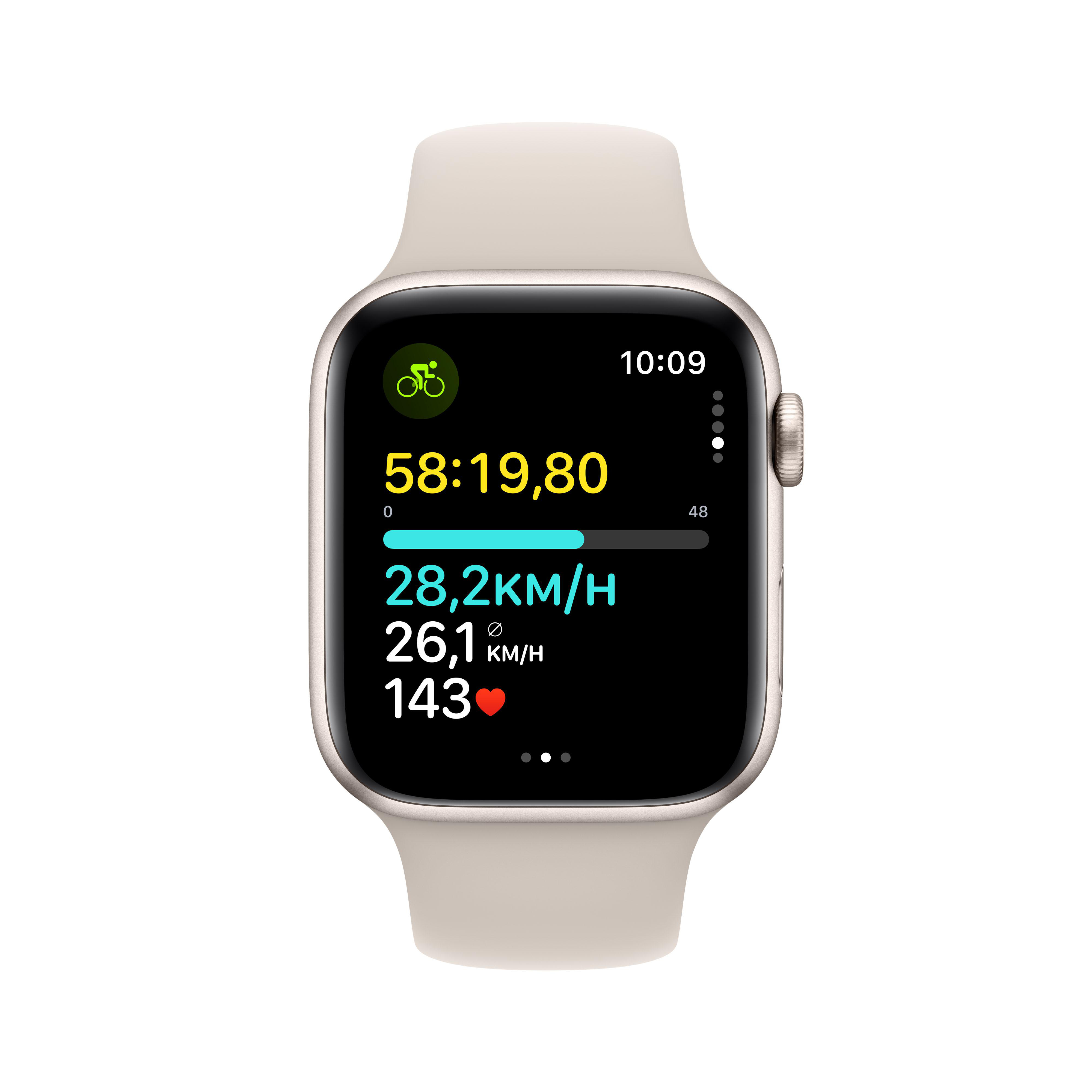 Apple Watch mit beigem Armband. Das Zifferblatt zeigt Radfahrdaten: Zeit, Geschwindigkeit, Herzfrequenz und Entfernung.