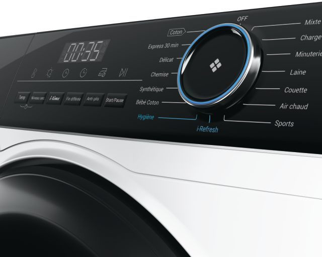 Washing machine control panel with a digital display and a large control dial.