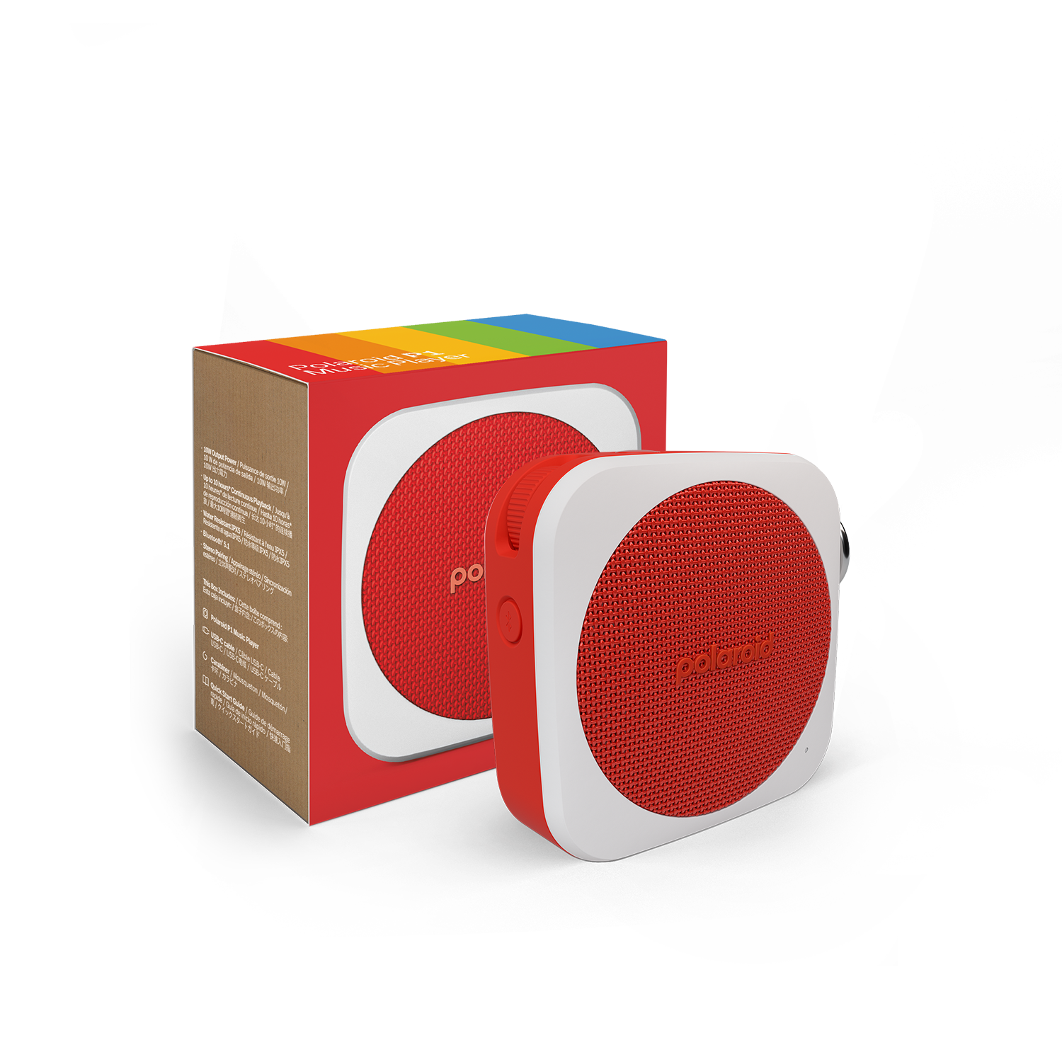 Kırmızı ve beyaz bir Polaroid hoparlör, kutusunun yanında, koyu bir yüzeyde duruyor.