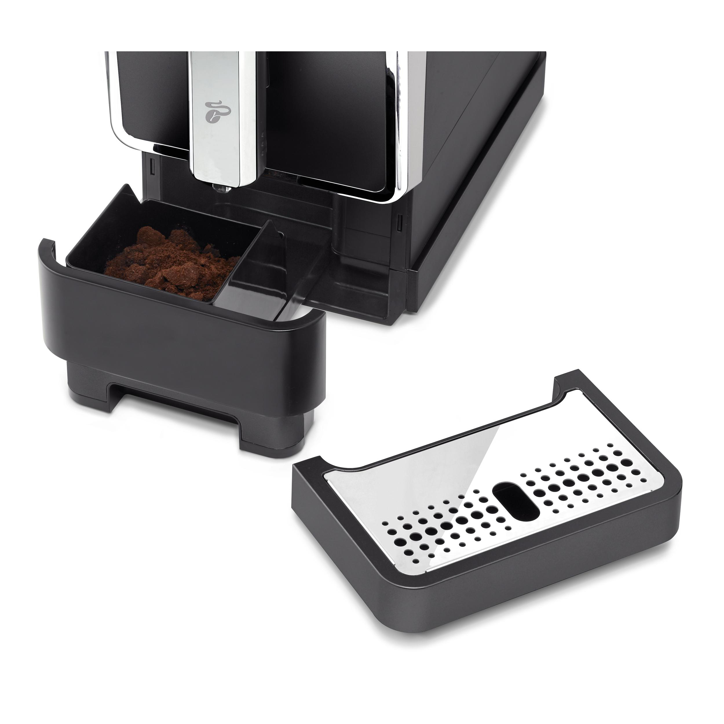Eine Kaffeemaschine mit getrennten Komponenten. Der Kaffeesatzbehälter ist sichtbar.