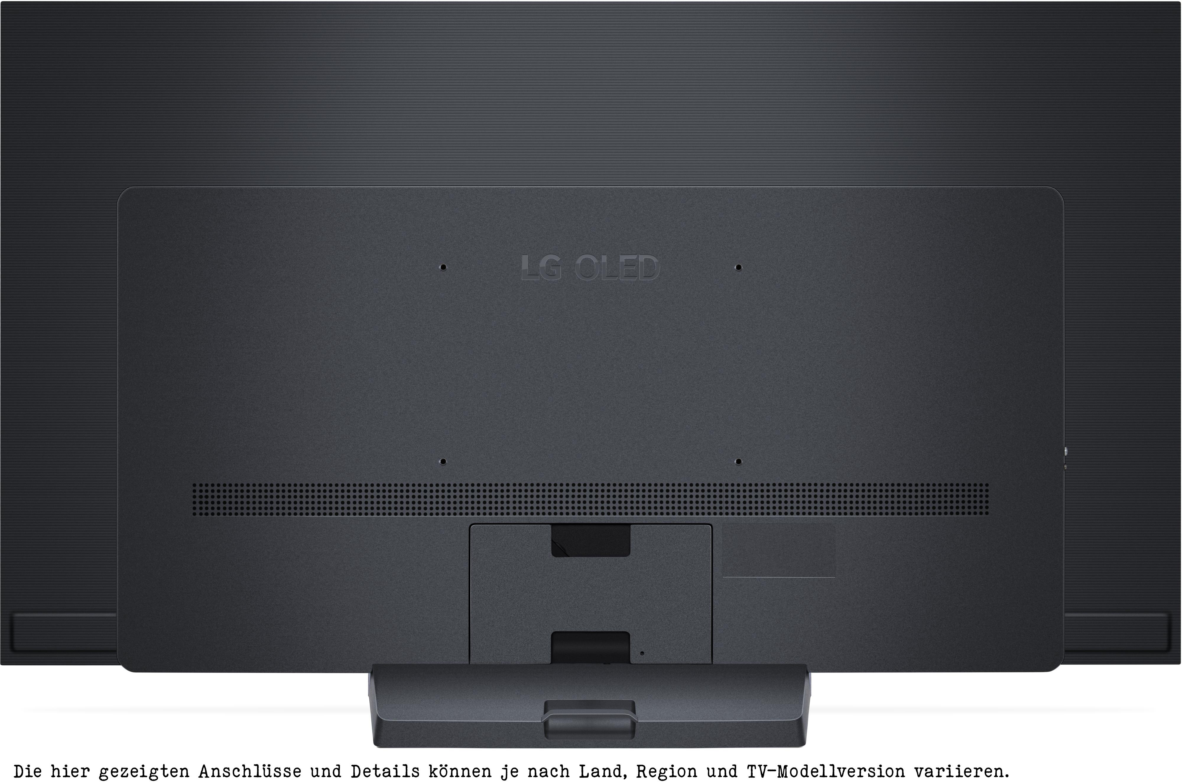 Rückseite eines schwarzen LG OLED TVs mit Anschlüssen und Ständer.