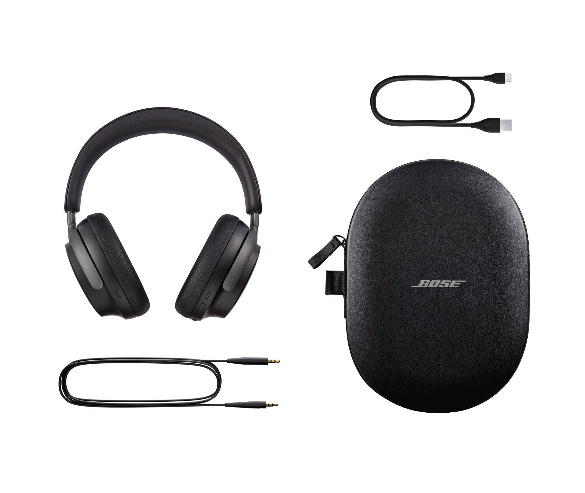 Bose-Kopfhörer, Etui und Kabel auf weißem Hintergrund, Kopfhörer sind schwarz und kreisförmig.