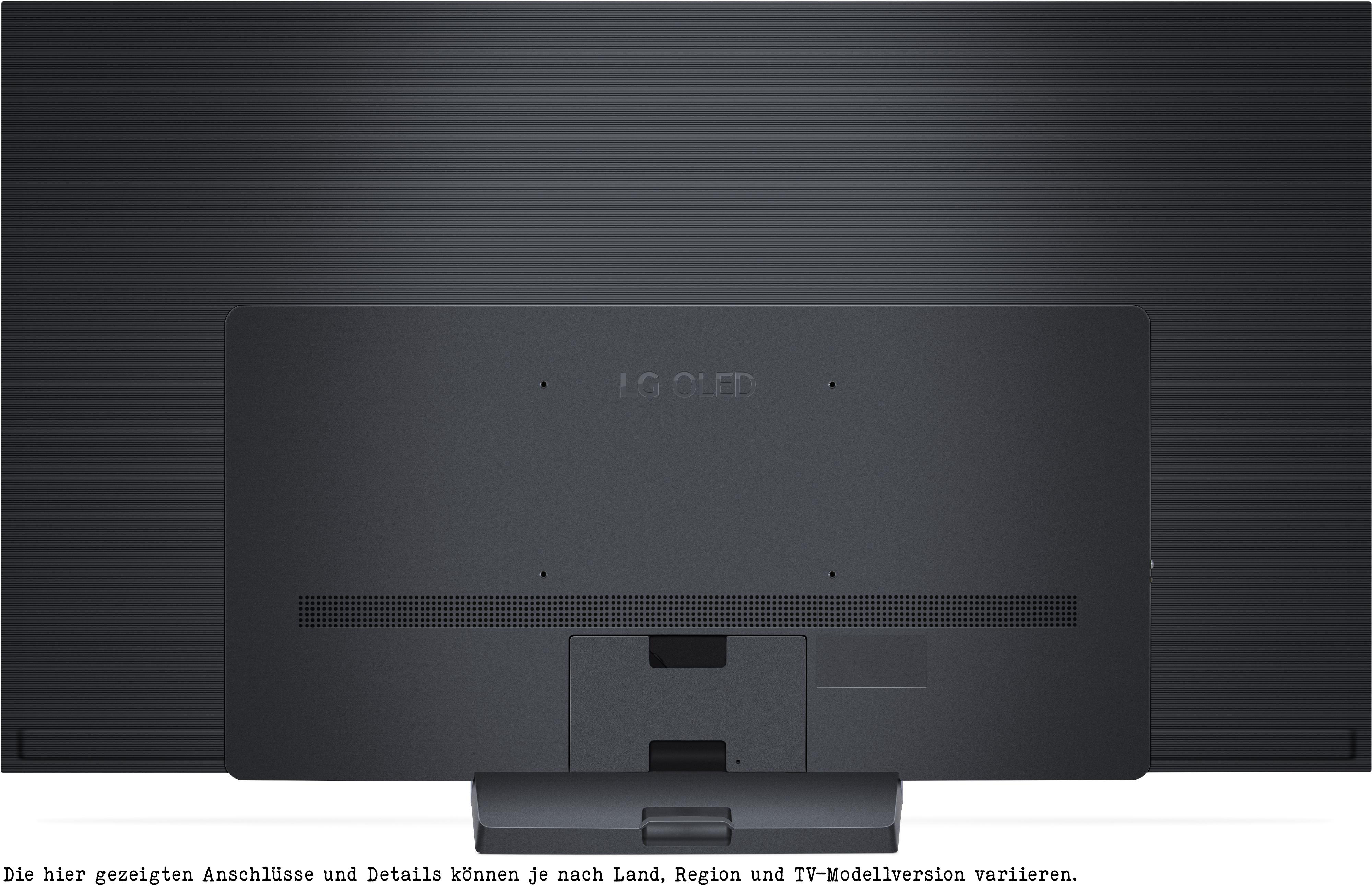 Rückseite eines schwarzen LG OLED-Fernsehers mit Anschlüssen und einem Ständer, mit dunklem Hintergrund und dem LG OLED-Logo.