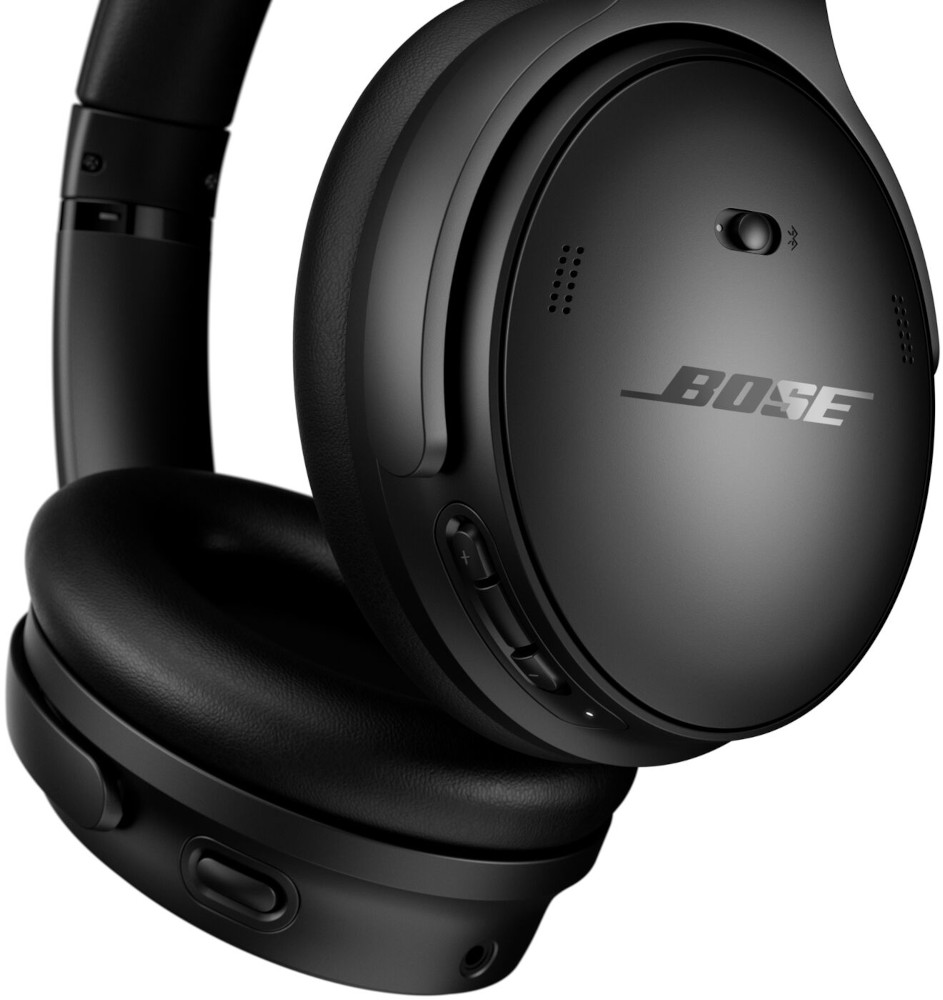 Black Bose headphones. Close-up view. Bose logo is visible. Matte finish.