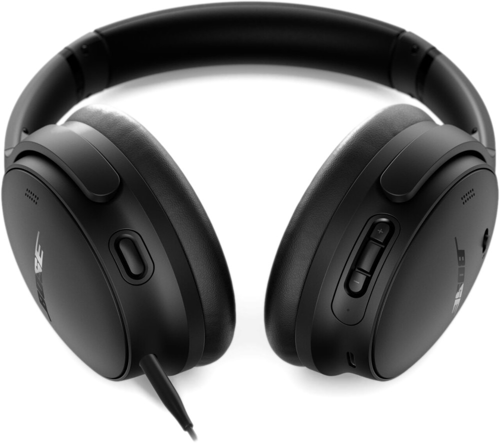 Black Bose headphones, detailed view. Earcups, controls visible. Cable extends down.