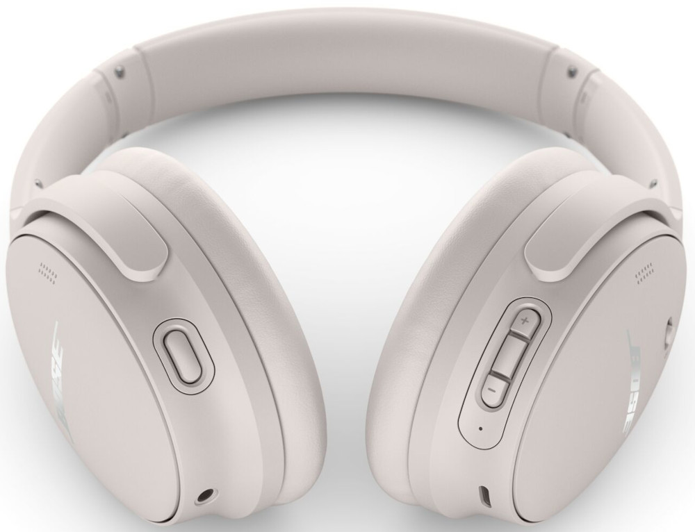 Light pink headphones with buttons and the Bose logo.