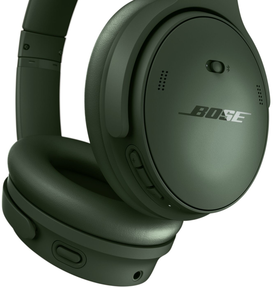 Groene Bose-hoofdtelefoon. De hoofdtelefoon staat op een witte achtergrond. Een knop is zichtbaar aan de zijkant.
