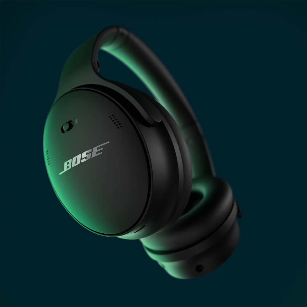 Zwarte koptelefoon met BOSE-logo zwevend op een blauw-groene gradiënt achtergrond.
