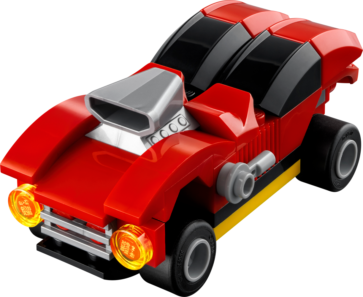 Egy Lego autó, piros fekete díszítéssel és fényszórókkal.