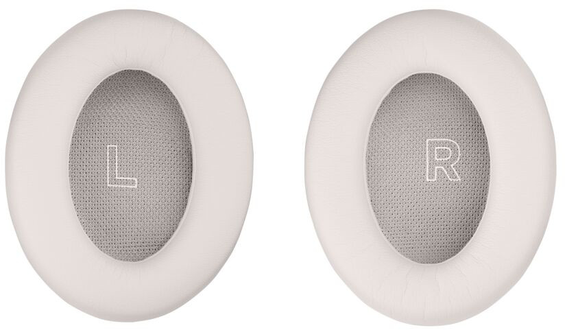Twee witte oorkussens voor hoofdtelefoons, gemarkeerd met 'L' en 'R' in grijs gaas.