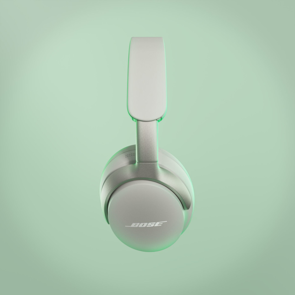 Witte Bose-hoofdtelefoon, met de merknaam zichtbaar, tegen een groene gradiëntachtergrond.