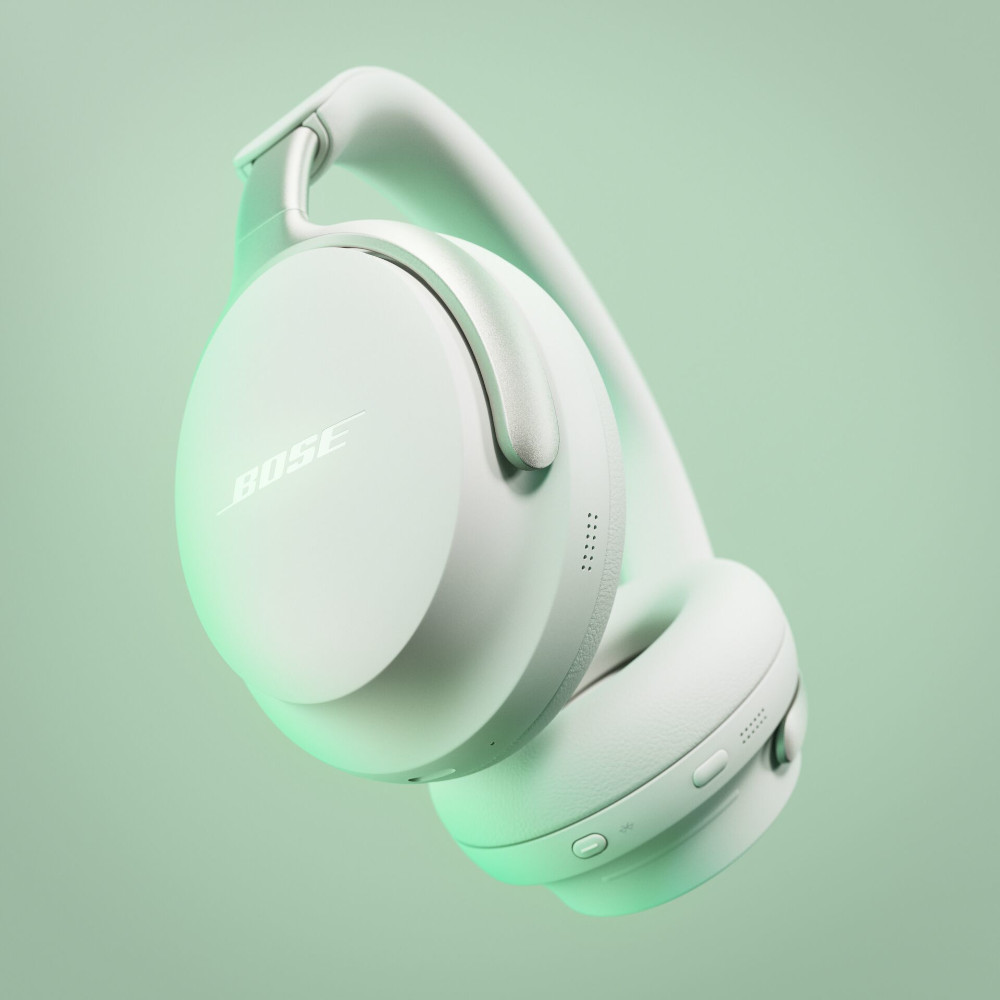 Witte Bose-koptelefoon, schuin, tegen een lichtgroene gradiënt achtergrond.