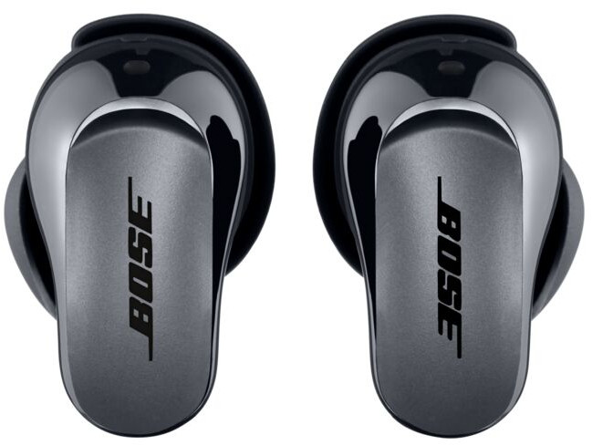 Two Bose earbuds in dark gray, face-up, with the Bose logo visible.