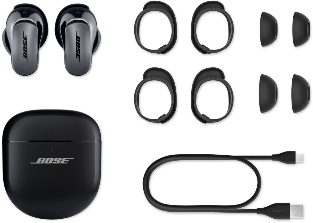 Earbuds, ear tips, ear loops, and a charging case, all in a white background.