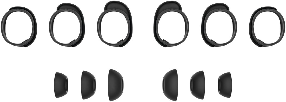 Black ear tips and a black band, components of a headset, laid out on a white surface.