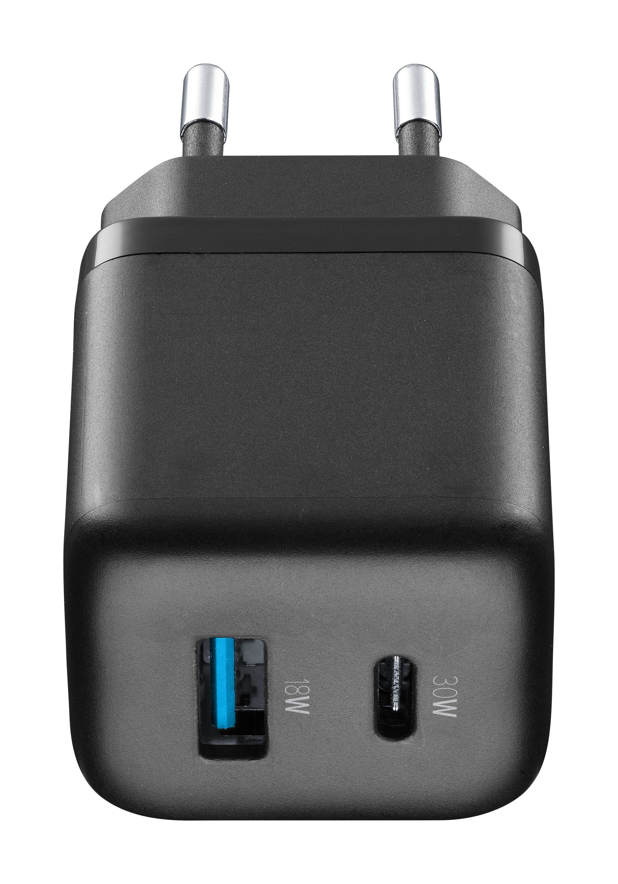 Schwarzes Telefonladegerät mit zwei Stiften und zwei USB-Anschlüssen, einem blauen und einem schwarzen.