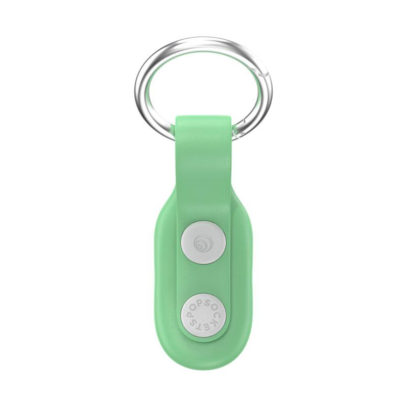 Grüner PopSockets-Schlüsselanhänger. Ein silberner Ring ist an einem grünen, ovalen Anhänger mit weißem Knopf befestigt.