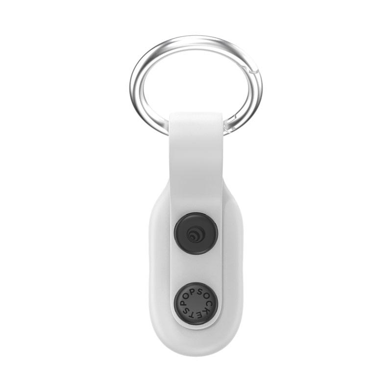 Weißer PopSockets-Schlüsselanhänger mit schwarzer runder Scheibe auf weißem Hintergrund.
