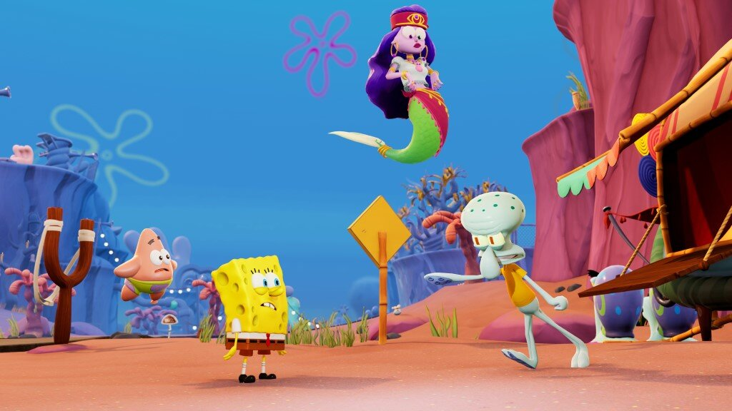 SpongeBob, Patryk i Skalmar w kolorowej scenie z kreskówki z syreną.