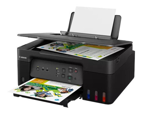 Drukarka Canon drukująca dokumenty z widocznymi kolorowymi wkładami atramentowymi.