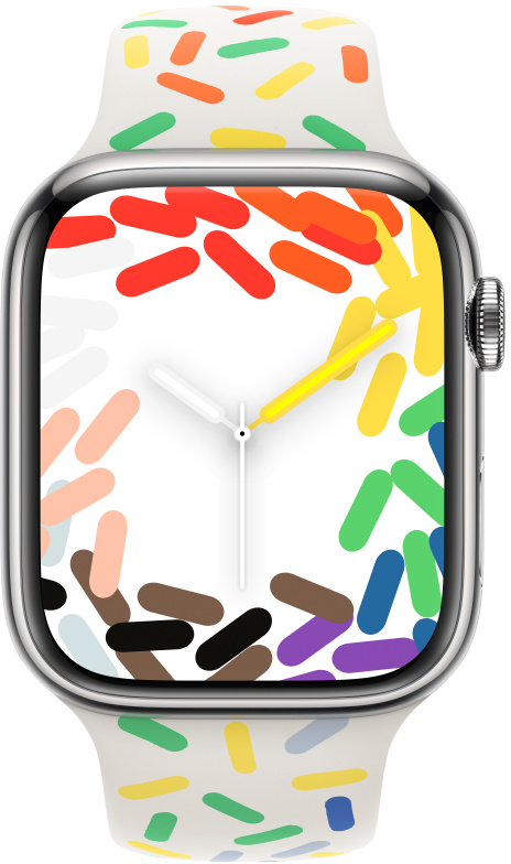 Apple Watch fehér szíjjal és színes cukormáz-mintával.