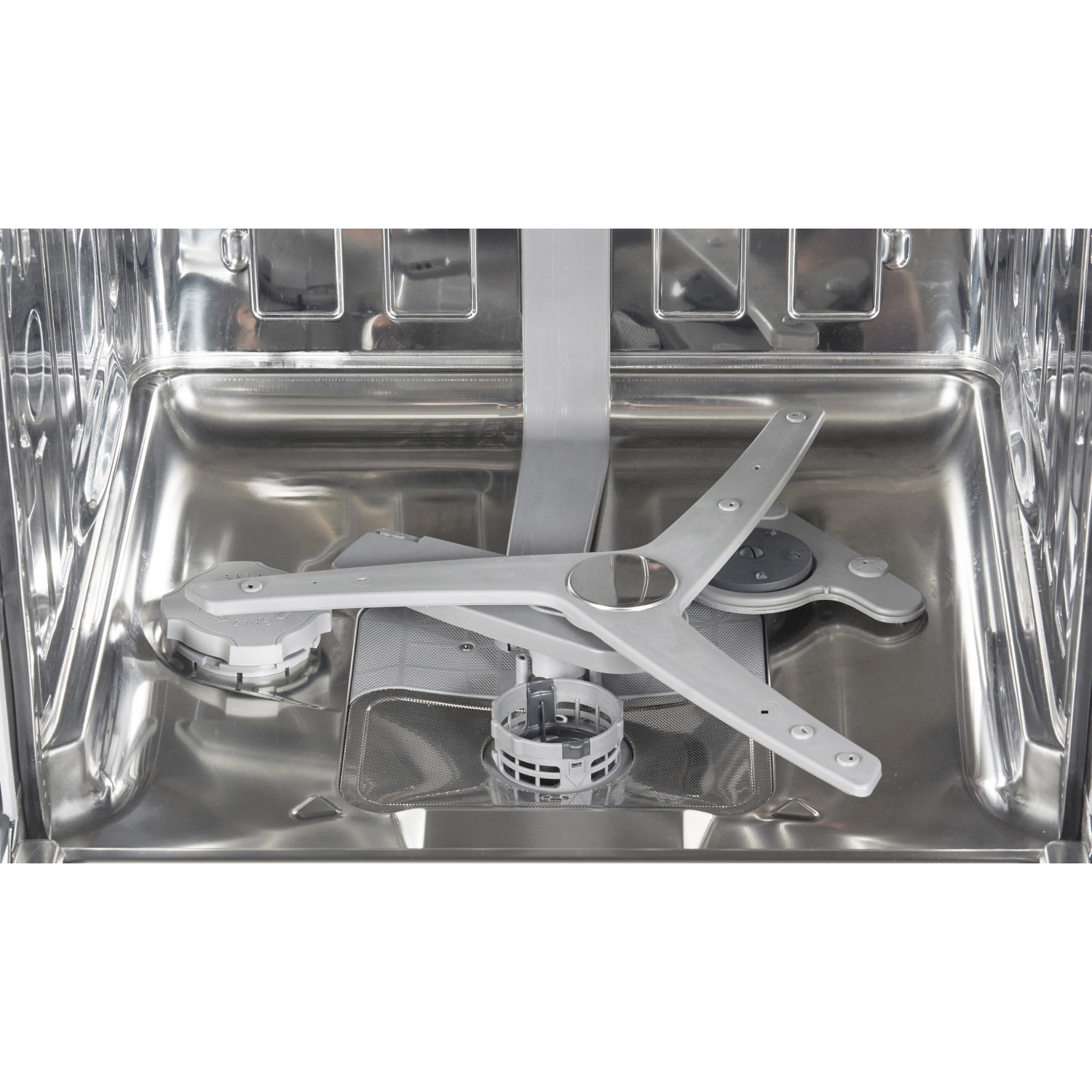 Interior of a dishwasher with spray arms and racks visible, shot against a black background.
